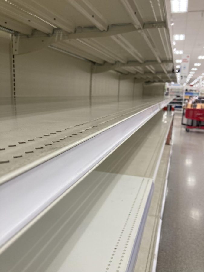 Panic+ensues+as+people+fight+over+food+in+Target+aisles+finding+all+the+shelves+completely+clearing+of+any+food.+Nearby%2C+lines+of+cars+formed+with+people+who+were+desperate+for+gas+to+top+off+their+already+filled+tanks.+Photo+courtesy+of+Lorelei+Woodward.