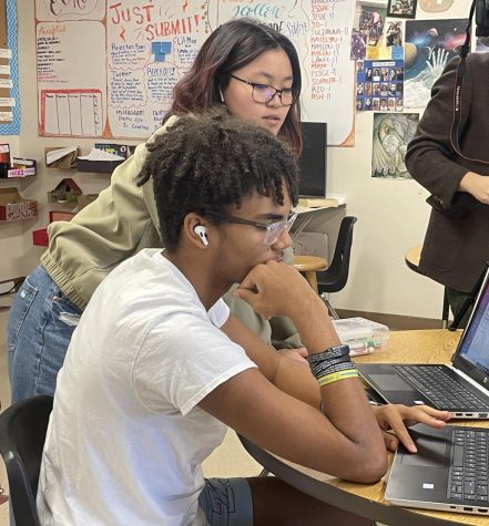 St udents work while unconsciously listening to music that impacts their work and peer communication. Since AirPods were released, they have overrun schools leading to unnecessary distraction and, in some cases, declining grades. Photo courtesy of Olivia Pages.