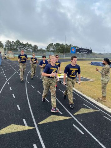 Steinbrenner’s JROTC Members prepare by running around the track. By practicing, they improve their skills for the competition. Photo courtesy of Jayden Otero. 