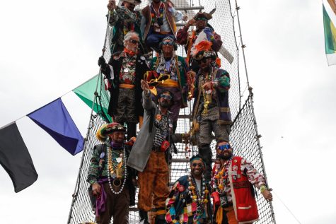 A group of pirates tosses beads to a crowd waiting below in 2023’s Gasparilla parade. The event took place on January 28, and resulted in countless groups celebrating together. Photo Courtesy of Tampa Bay Times.