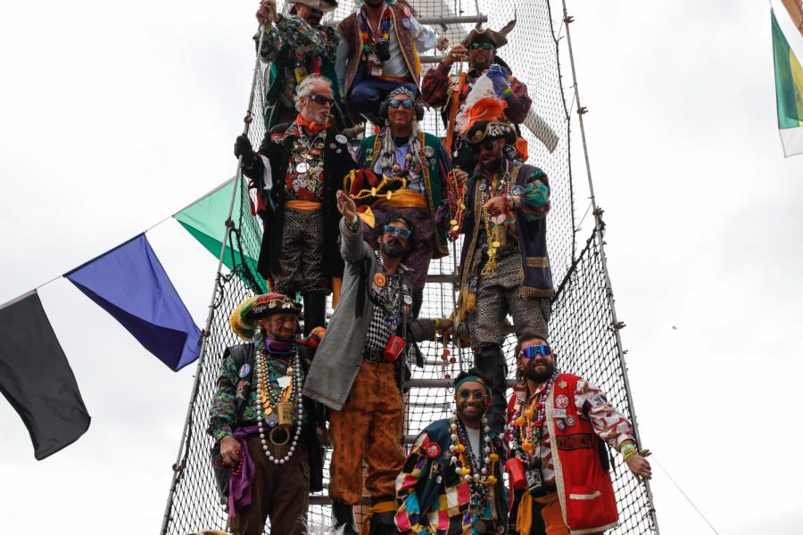 A+group+of+pirates+tosses+beads+to+a+crowd+waiting+below+in+2023%E2%80%99s+Gasparilla+parade.+The+event+took+place+on+January+28%2C+and+resulted+in+countless+groups+celebrating+together.+Photo+Courtesy+of+Tampa+Bay+Times.