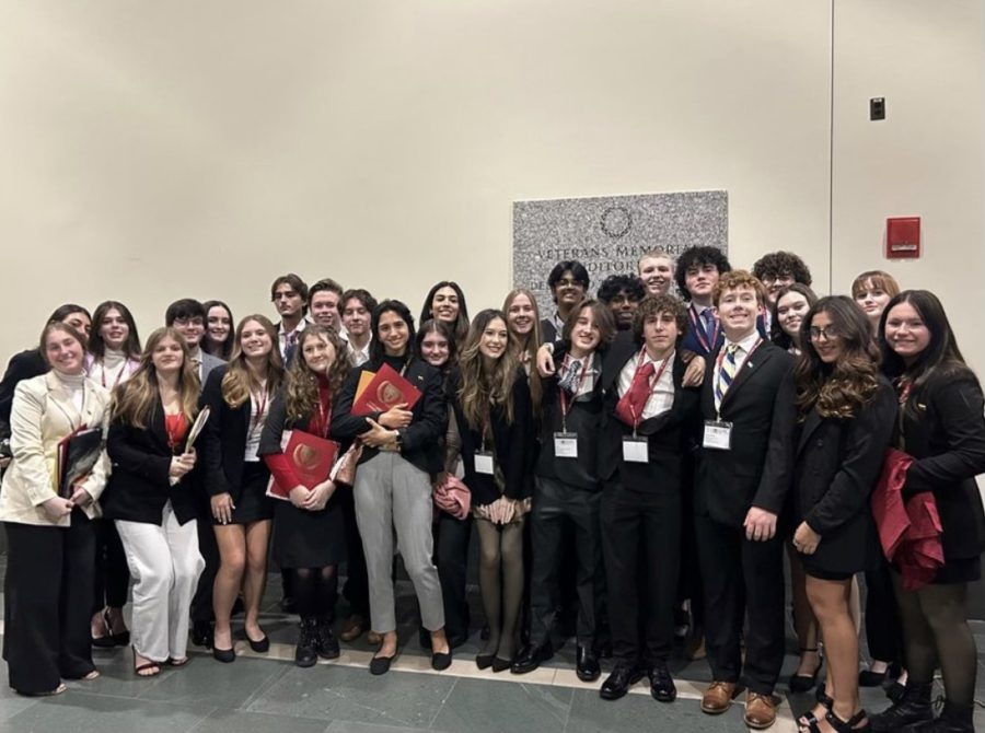  Model UN students pose after opening ceremonies, ready to go to their first committee session. Over the span of five days, club members spent time in Boston developing their diplomatic skills. Photo courtesy of Kelly Miliziano. 