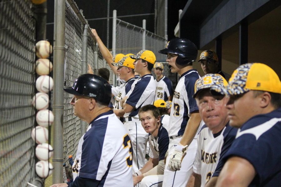 The+Warriors+are+focused+as+they+watch+the+game+from+the+dugout+and+cheer+on+their+teammates.+Friends+and+family+continued+the+support+from+the+bleachers+as+Steinbrenner+took+the+win+for+the+night.+Photo+courtesy+of+Tammy+Budiman.+