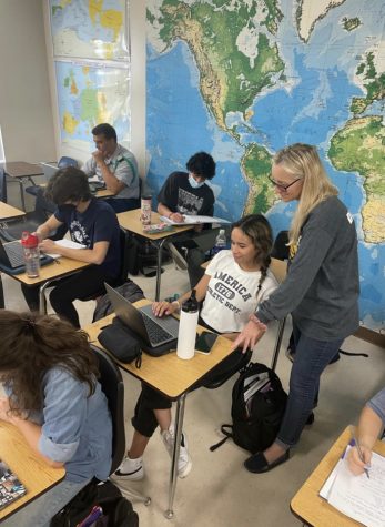 Senior sponsor Dr Barton helps her history students complete their assignment. Shes been working hard to maintain her role as senior sponsor and as a history teacher. Photo courtesy Anise Hansel