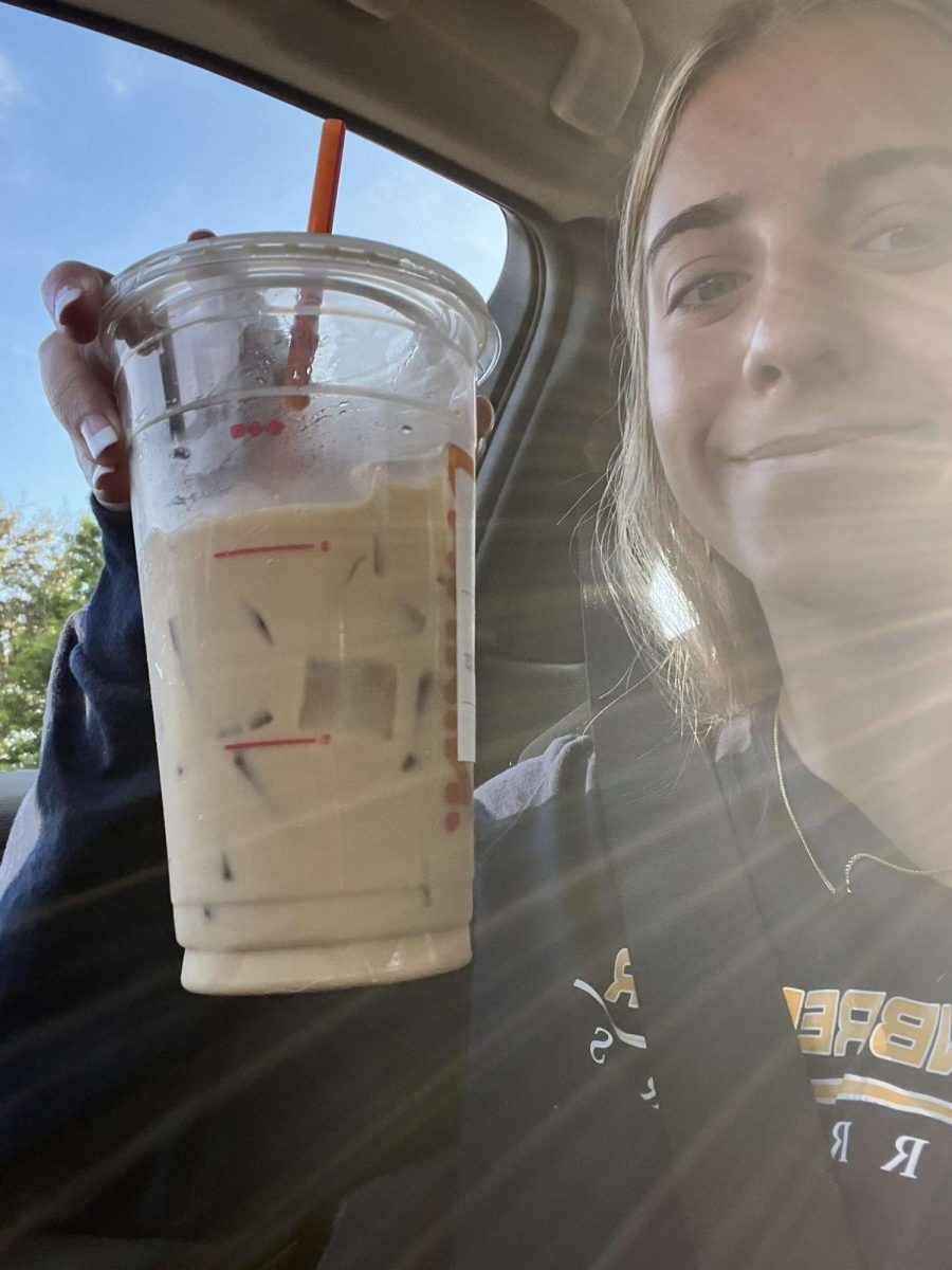  

Pictured here is Reese Davis with her iced pumpkin coffee with cream. She has waited months for pumpkin to finally come back in stock. Photo courtesy of Reese Davis. 