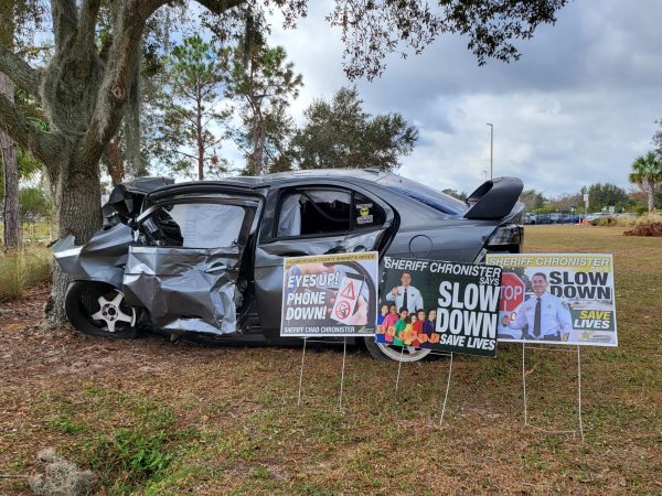 A car wreck, using a real vehicle, is staged outside Steinbrenner near the car line. This is used to bring awareness to the dangers of reckless driving. Photo courtesy of Weather Riley 