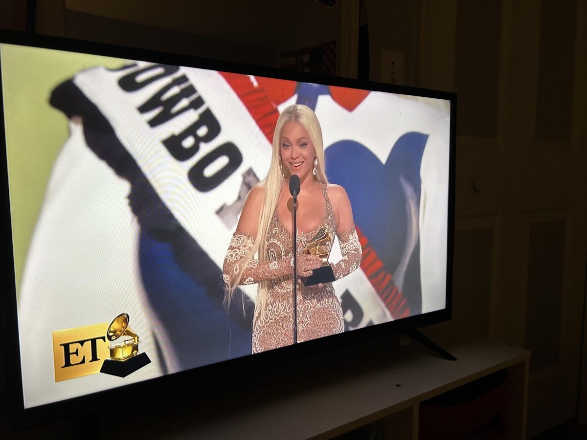 Beyoncé on stage as she accepts the award for Album of the Year for her album, “Cowboy Carter.” Nominated for this category four times, she makes history, winning this award for her first time ever. Photo courtesy of Kate Caraynoff. 