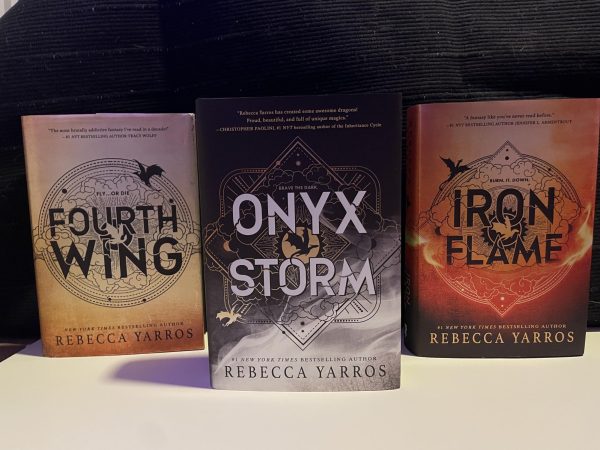 The three books written by Rebecca Yarros, including Fourth Wing, Iron Flame, and Onyx Storm in the middle, the newest book in the Empyrean series. Onyx Storm was released January 21st and was a quick best seller. Fans flooded the stores for a copy, only to be disappointed and not get one from how poorly Target handled the release. 