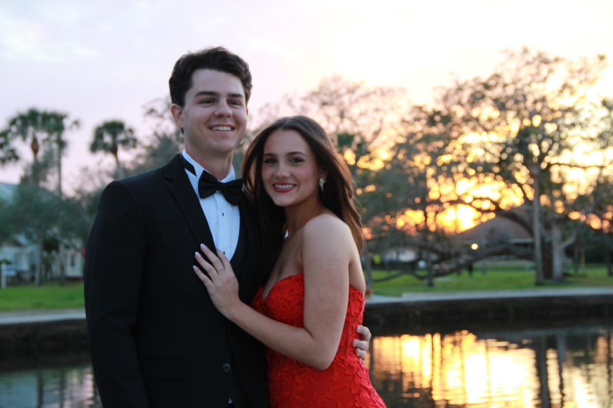 Senior Aubree Gunn and her boyfriend, Carter Caraynoff, posing for a prom photo to capture the special moment. The two chose to take photos at the Bayou in Tarpon Springs while others chose spots like golf courses, backyards, or even outside the prom venue. Photo courtesy of Aubree Gunn.  

 