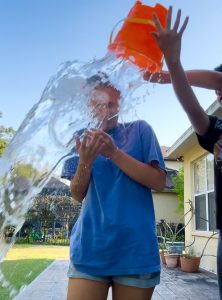 Water is poured on junior Malia Kirschman’s head to participate in the USC Speak Your MIND challenge. The goal of the challenge is to spread mental health awareness and get rid of stigmas surrounding mental health. Photo Courtesy of Malia Kirschman.  