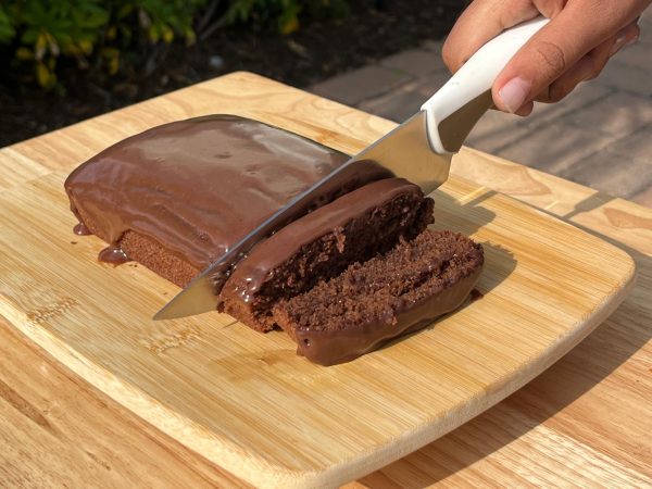 A dump cake being cut into warm, gooey slices. This simple, eggless dessert made a quiet comeback from its Depression-era origins. Photo courtesy of Shirin Kohli. 