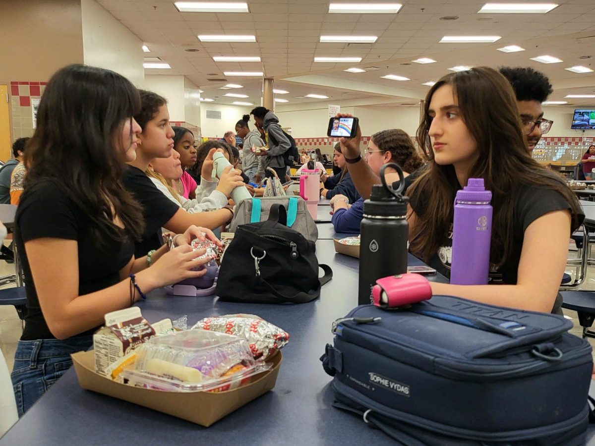 Students in the Steinbrenner cafeteria conversing over lunch served by the school. Steinbrenner has been serving warm meals to students since 2009. Photo courtesy of Weather Riley. 
