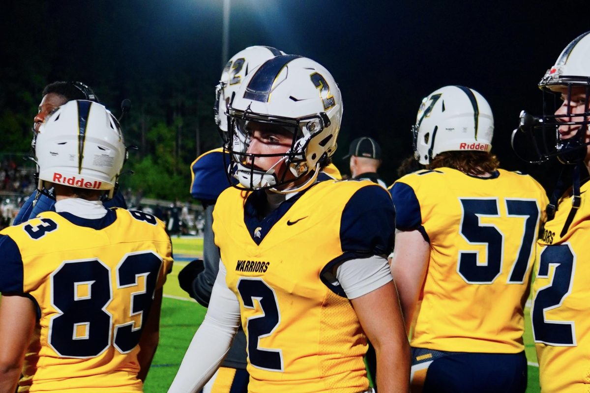 Rylen Dutka and his teammates walking off the field during half time. During half time, Steinbrenner's color guard performed a show.