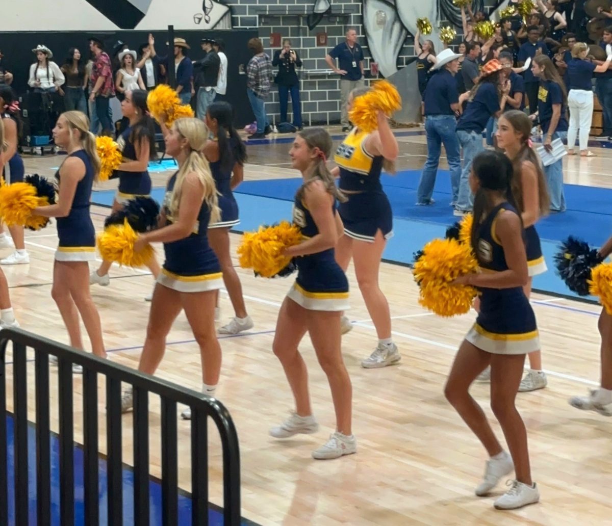 Left to Right, Back row: Ashleybeth Calix-Sori, Ademy Malave, Lily Astin, Gianna Puntureri, Front row: Sophia Muzio, Carmen Valladares, Cora Carew, Allison Colon. Steinbrenner cheerleaders at the pep rally performing a routine for the incoming students. Traditionally, Steinbrenner cheerleaders perform at every pep rally. Photo courtesy of Isabel Liberos.