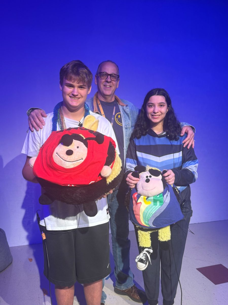 Mr. Jaycox and 2 ESE students filming the morning show together. This past school year, Mr. Jaycox's students have been reading the school lunch menu on the morning show.