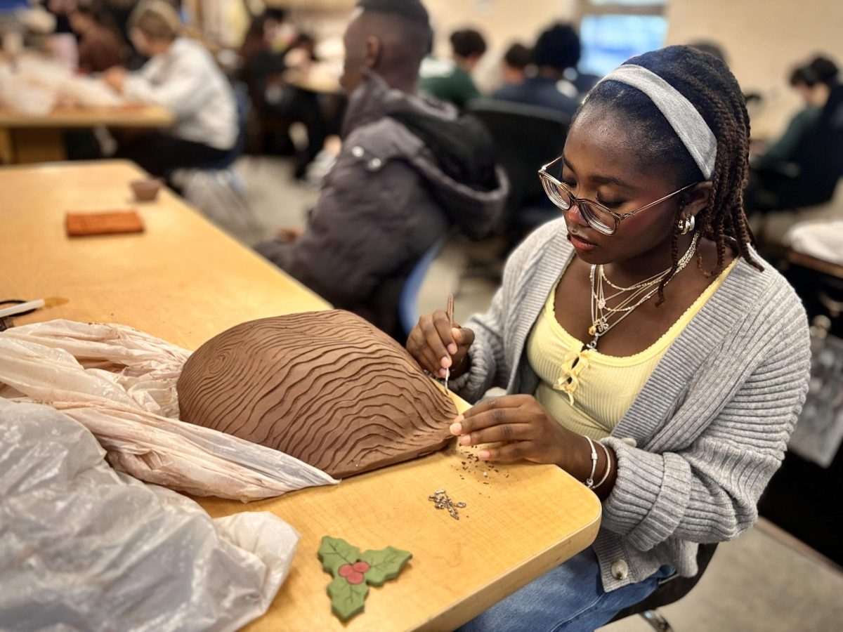 Celia Bentil working on a ceramic project for an upcoming assignment. Ceramics has been a popular art class for many students. Photo courtesy of Serenity Valentine.