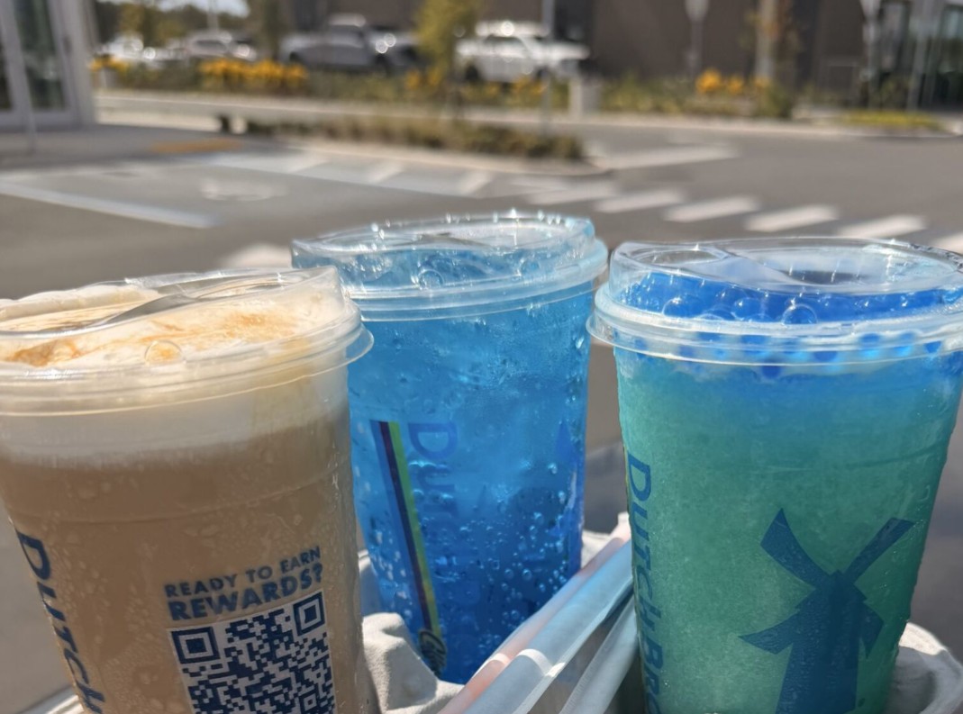 The drink to the left is an iced golden eagle, known for its simple but sweet flavors. The drink in the middle is the Blue Rebel, a popular energy drink. Lastly, the drink to the right is the blended sour berry blast rebel drink energy. Dutch Bros beverages are known to be vibrant and eye catching to Floridians. Photo Courtesy of Lewis Dailey 