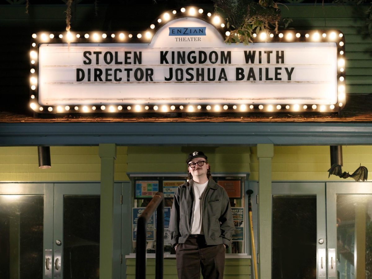 Joshua Bailey stands in front of the Enzian Theater in Orlando ahead of the premiere of Stolen Kingdom. Growing up, Bailey was always interested and exposed to subculture content like that of his film, which made the writing relatively easy for him. Photo Courtey of Joshua Bailey. 