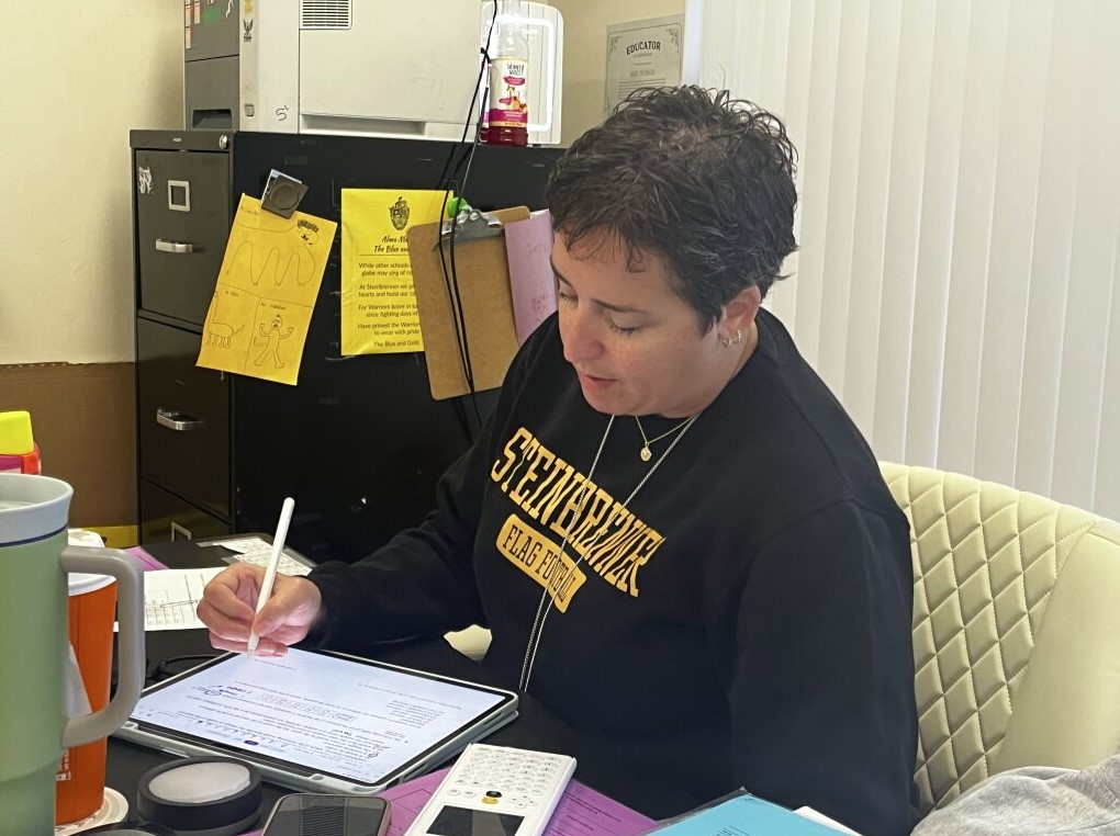 Mrs. Puskas making working on her iPad to create social media content before school hours. It usually takes Mrs. Puskas 3 hours for one post. Photo courtesy of Shirin Kohli.